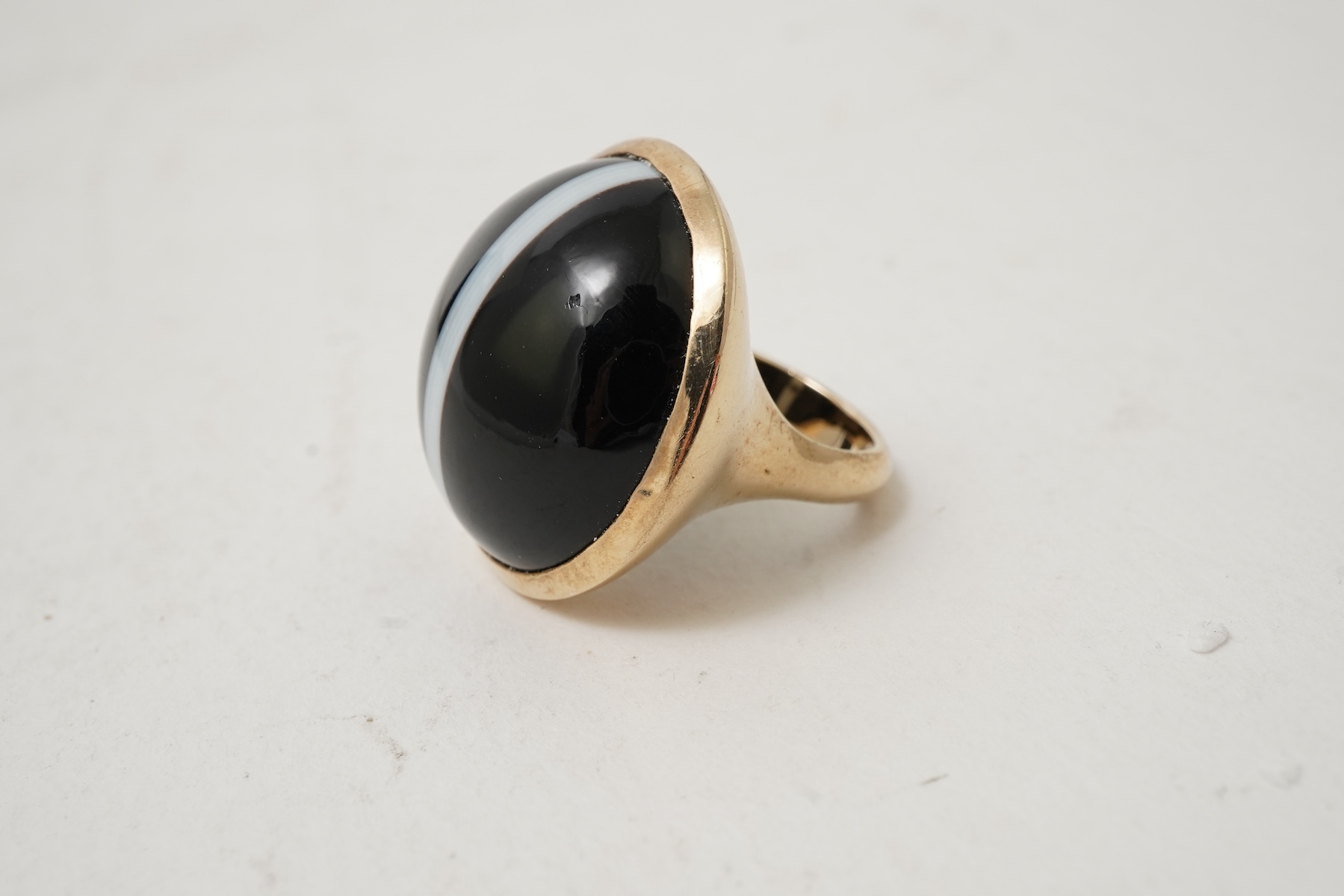 An onyx dress ring and pair of earrings